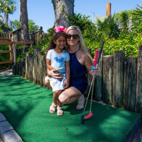 Guests posing at mini golf