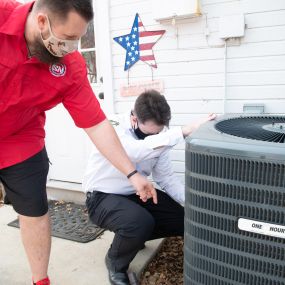 Technician going over a new air conditioner installation in the Irving, TX area.