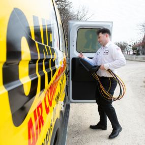 One Hour Air Conditioning & Heating of Dallas, TX technician out on an air duct cleaning service call.