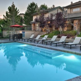 Resort style swimming pool with outdoor lounge  at Camden Denver West Apartments in Golden, CO