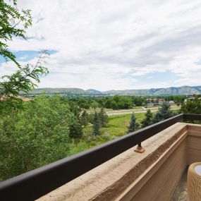 Outdoor balcony with mountain view  at Camden Denver West Apartments in Golden, CO