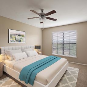 Spacious bedroom with ceiling fan  at Camden Denver West Apartments in Golden, CO