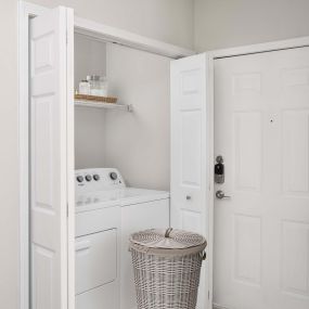 Laundry area with full-size washer and dryer at Camden Creekstone in Atlanta GA