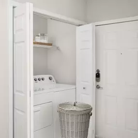 Laundry area with full-size washer and dryer at Camden Creekstone in Atlanta GA