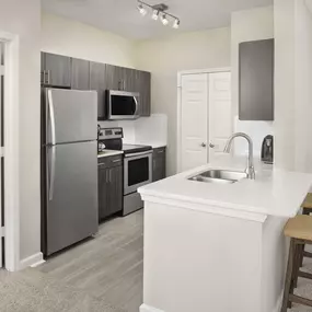 Kitchen with white quartz countertops at Camden Creekstone in Atlanta GA