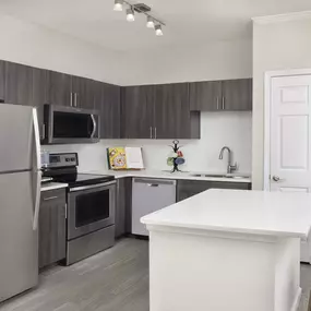 Kitchen with large island at Camden Creekstone in Atlanta GA