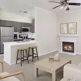 Living room with fireplace at Camden Creekstone in Atlanta GA