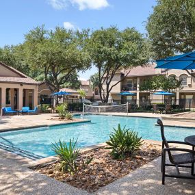 Resort-style pool with deck seating at Camden Cimarron apartments in Irving, TX