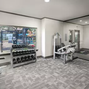 Fitness center entry with free weights and bottle filling station