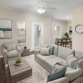 Living room with wood-style floors throughout at Camden Cimarron