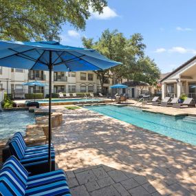 Resort-style pool with fountain at Camden Legacy Park apartments in Plano, TX