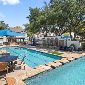 Resort-style pool with two levels and sundeck at Camden Legacy Park apartments in Plano, TX