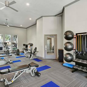 Fitness center with machines and free weights