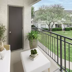 Private balcony overlooking greenspace at Camden Legacy Park apartments in Plano, TX