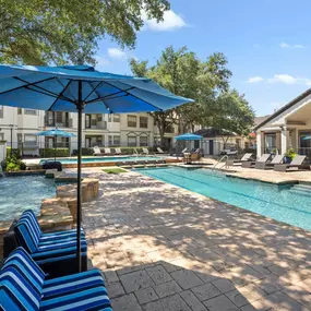 Resort-style pool with fountain at Camden Legacy Park apartments in Plano, TX