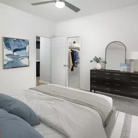 Bedroom with modern ceiling fan, walk-in closet, and ensuite bathroom at Camden Legacy Park apartments in Plano, TX