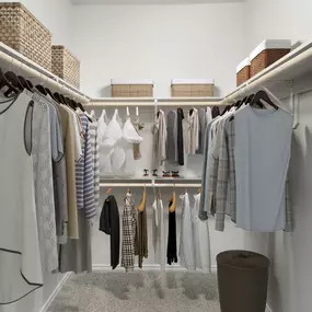 Walk-in closet with built-in shelves at Camden Legacy Park apartments in Plano, TX