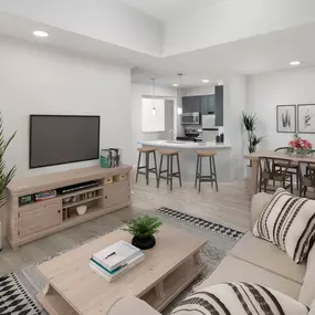 Living room, dining and kitchen with wood-style flooring