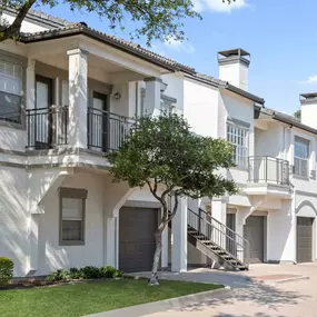 Building exterior with private balconies and garages at Camden Legacy Park