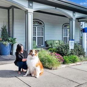 Person with dog at Camden Ashburn Farm in Ashburn, Virginia.  Pet-friendly community.