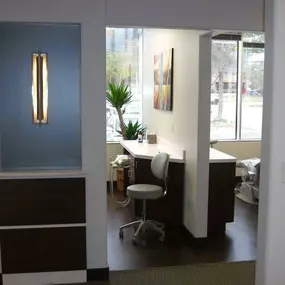 view of rooms inside dental office from the hallway