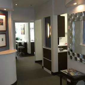 View from hallway inside dental office leading to separate rooms