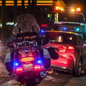 Police motorcycle at the scene of a car accident