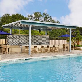 Resort-Style Pool with Covered Grilling and Bar Area