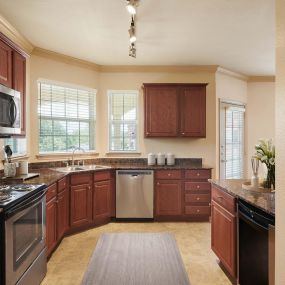 Traditional Style kitchen featuring granite countertops, stainless steel appliances, and wine refrigerator.