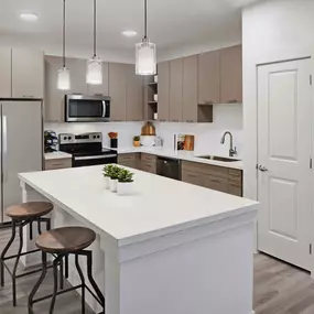 Contemporary style kitchen with quartz countertops and stainless steel appliances