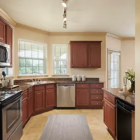 Traditional Style kitchen featuring granite countertops, stainless steel appliances, and wine refrigerator.