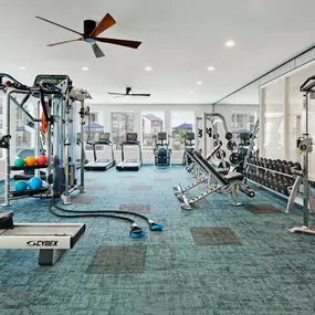 24- hour Fitness Center with rowing machine, cardio equipment, and free weights