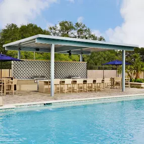 Resort-Style Pool with Covered Grilling and Bar Area