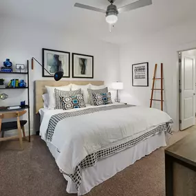 Contemporary Style bedroom with high ceilings, ceiling fan and natural lighting