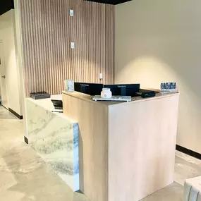 White oak slat accent wall and waterfall counters help modernize and add luxurious vibes to any residential or commercial space.