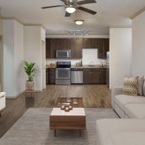 Open kitchen and living room wood inspired flooring led track lighting and lighted ceiling fan