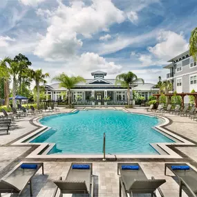 Tropical pool with cabanas and grill pavilion