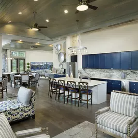 Resident lounge with demonstration kitchen and seating area