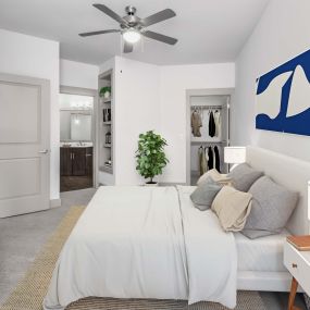 Bedroom with ensuite bath, walk-in closet, and ceiling fan at Camden Southline
