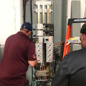 The team working on a 2000 amp, 480 volt 3-phase electrical panel