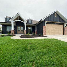 Check out this beautiful home by Spillman Homes. Garage doors by G.P. Construction. Model 5983 in Natural Oak .