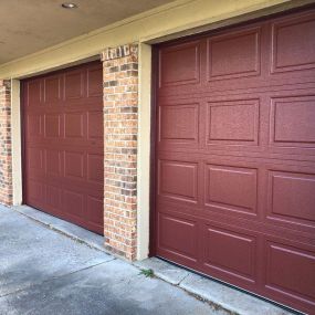 Check out these newly installed Country Red doors by Pro-Door Model 6410