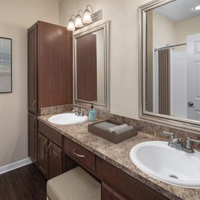 Bathroom with two sinks and vanity area at Camden Buckingham apartments in Richardson, Tx