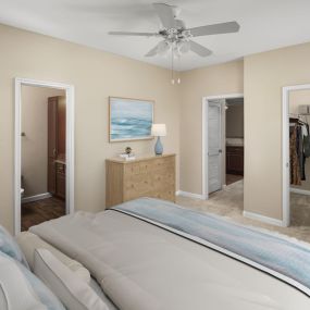Bedroom with walk-in closet and ensuite at Camden Buckingham apartments in Richardson, Tx