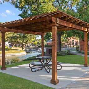 Lakeside cabana with picnic table at Camden Buckingham