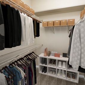 Walk in closet with built-in wire shelves at Camden Buckingham apartments in Richardson, Tx