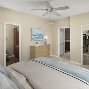 Bedroom with walk-in closet and ensuite at Camden Buckingham apartments in Richardson, Tx