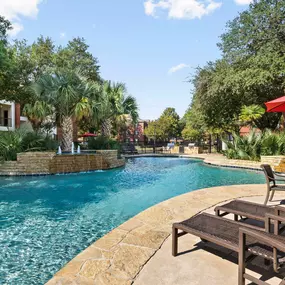 Resort-style pool with poolside seating at Camden Buckingham