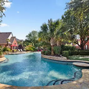 Resort-style pool with in-water table at Camden Buckingham