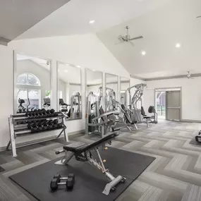 24-hour fitness center with strength equipment at Camden Buckingham apartments in Richardson, TX